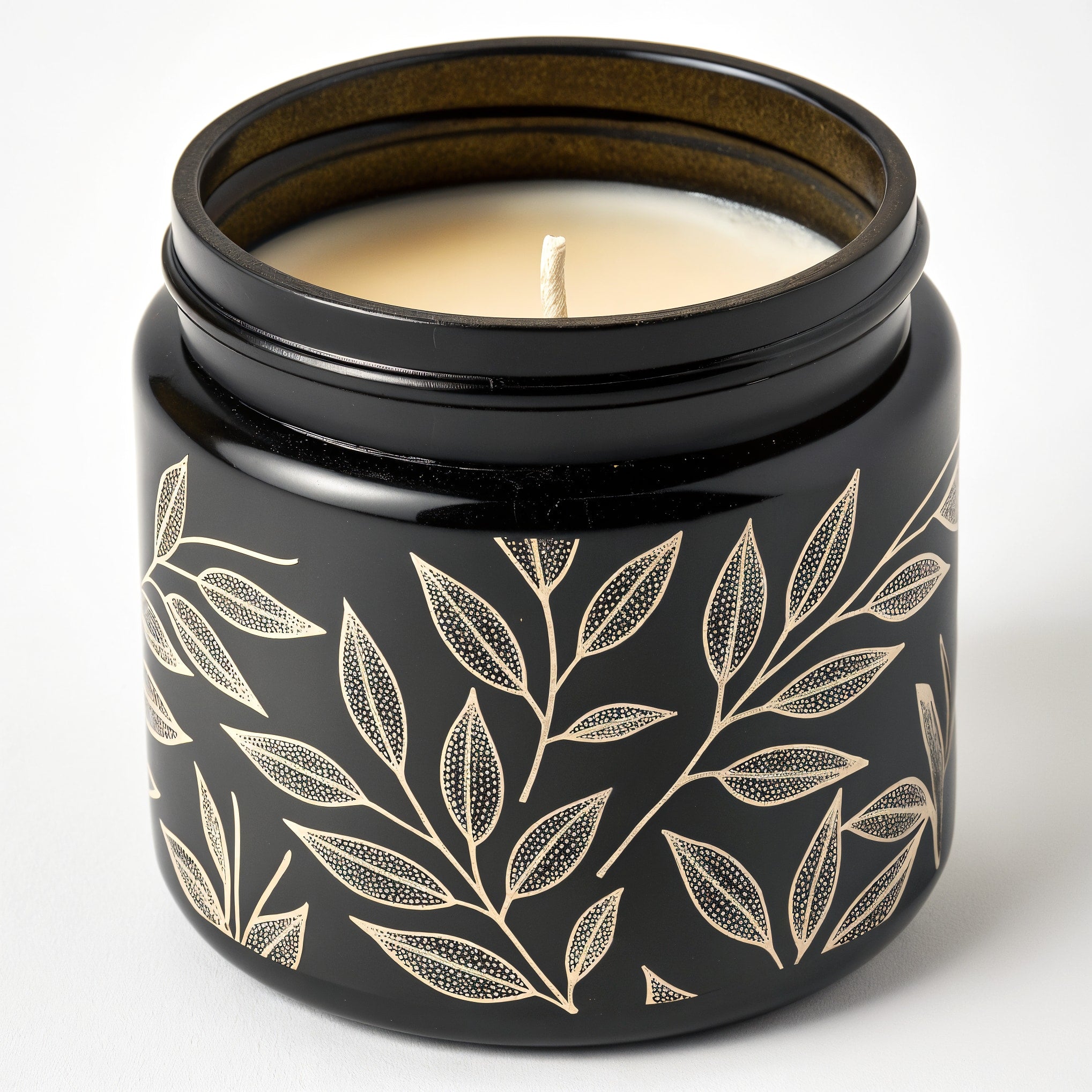 Naldony Black Tea Soy Candle — black jar with tea leaf pattern, front view