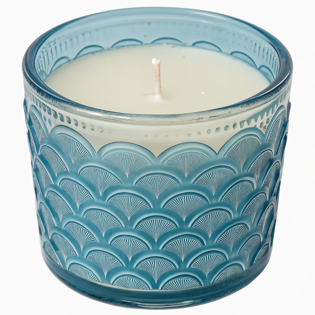 Naldony Ocean Mist Soy Candle — three-quarter front view in blue glass jar with wave pattern