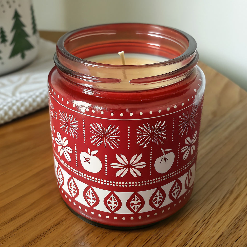 Naldony Spiced Apple Soy Candle — front view of red jar with festive pattern