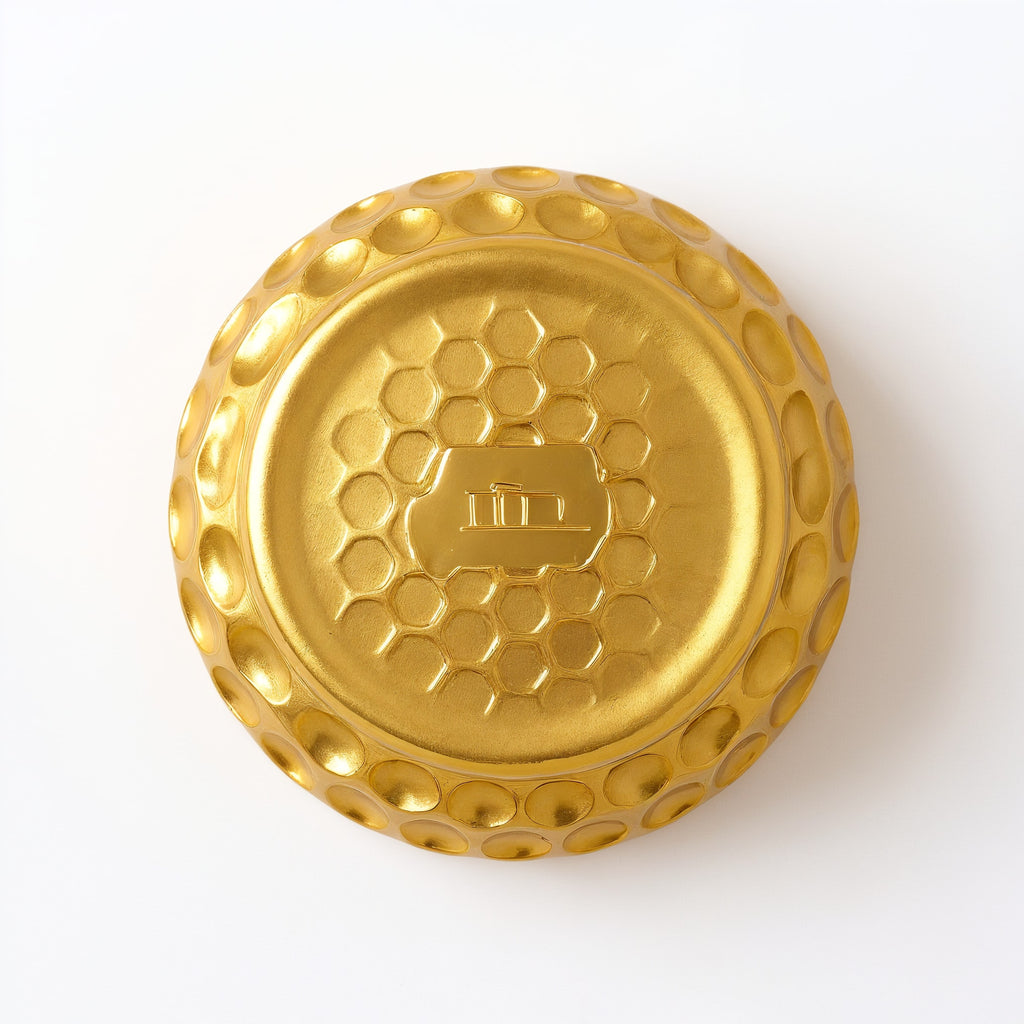 Naldony Honey Nectar Soy Candle — underside view showing the base of the golden jar