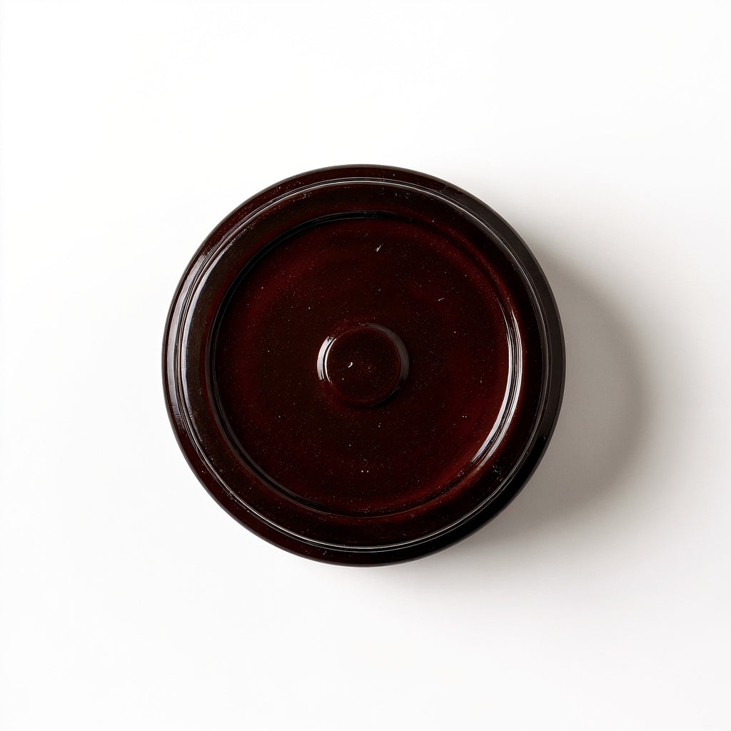 Naldony Cedarwood Musk Soy Candle — base view showing texture