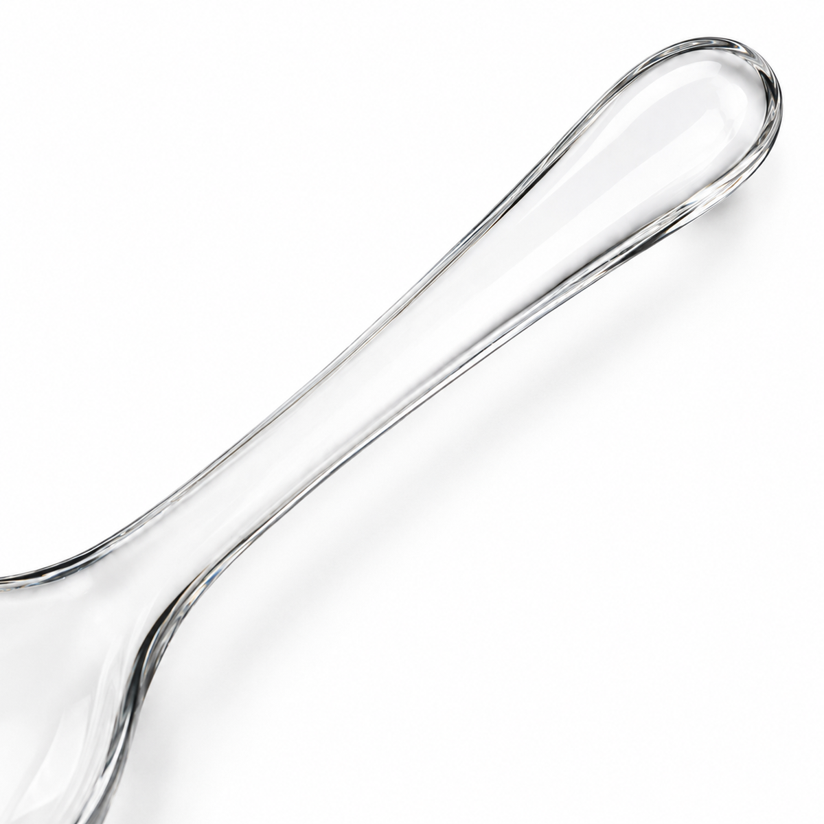 Close-up of glass spoon showing integrated handle.