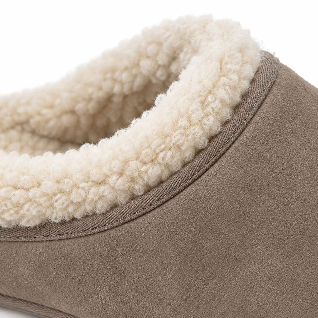Angled view of the slipper's suede exterior.