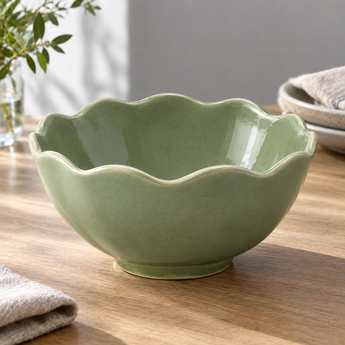 Side angle of sage green naldony ceramic bowl.