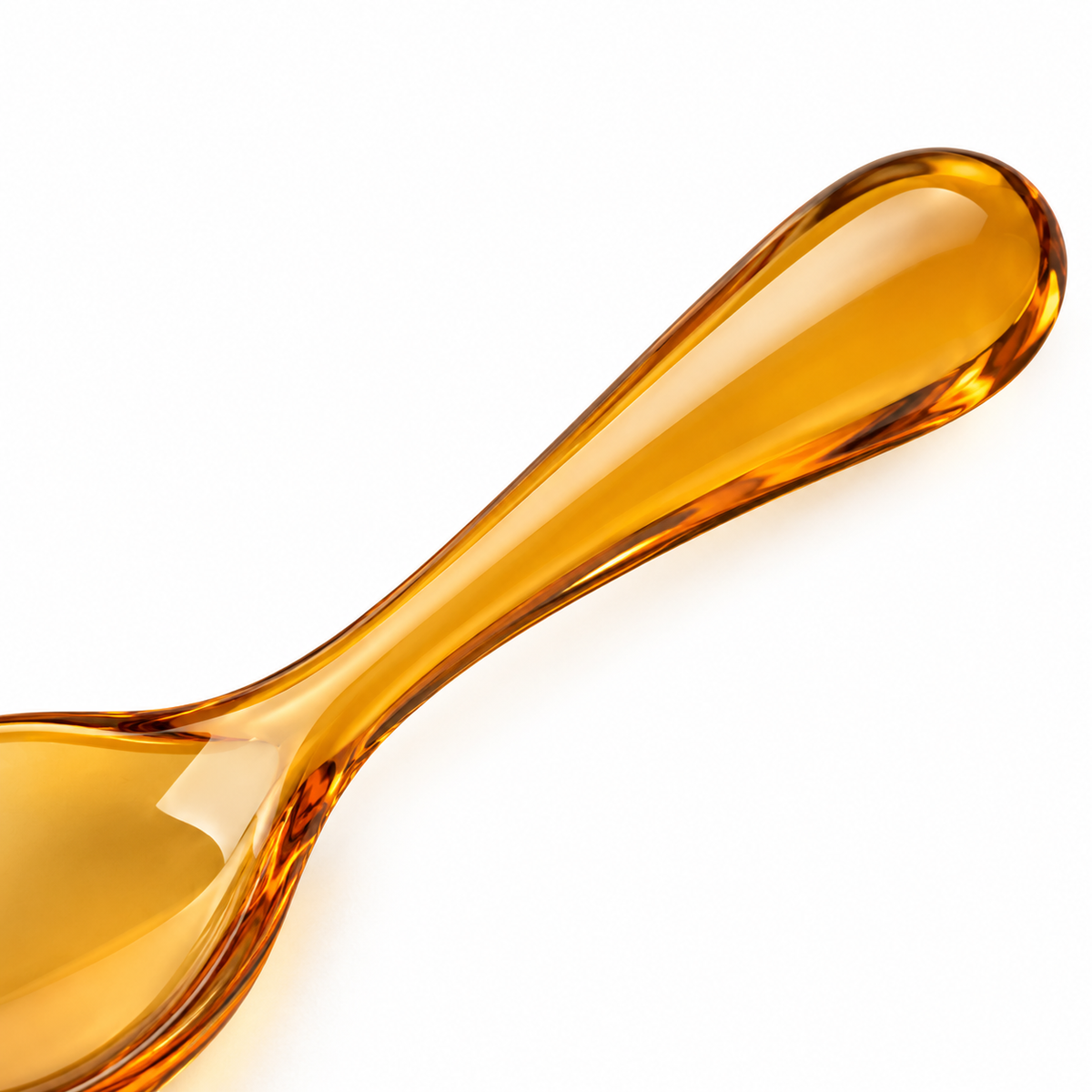 Amber spoon on white background.