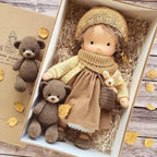 Waldorf-style rag doll with knitted clothes