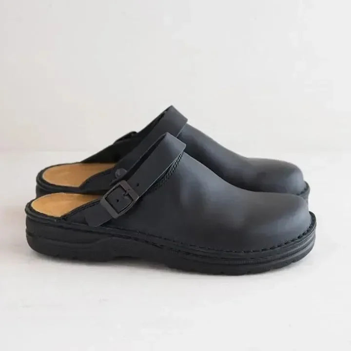 Closed toe leather-look clogs with buckle strap
