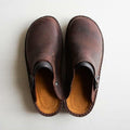Closed toe leather-look clogs with buckle strap