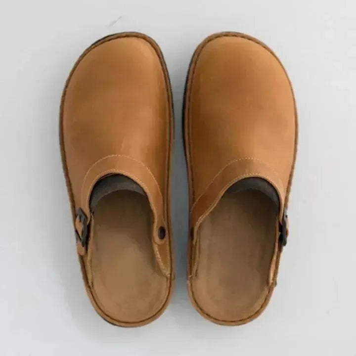Closed toe leather-look clogs with buckle strap