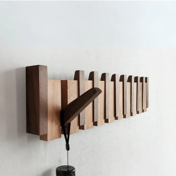 Wall-mounted wooden piano coat rack with flip-down hooks