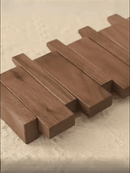 Wall-mounted wooden piano coat rack with flip-down hooks