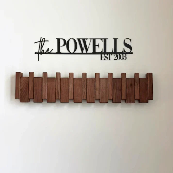 Wall-mounted wooden piano coat rack with flip-down hooks