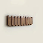 Wall-mounted wooden piano coat rack with flip-down hooks