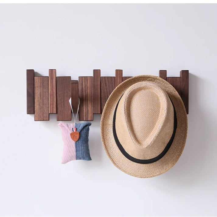 Wall-mounted wooden piano coat rack with flip-down hooks