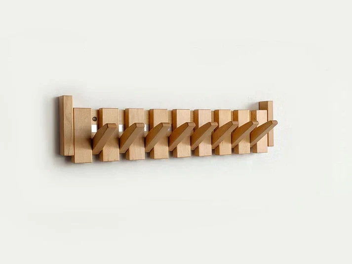 Wooden wall mounted coat rack with flip-down piano key hooks