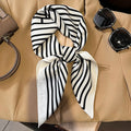 Silk checkered scarf with charm