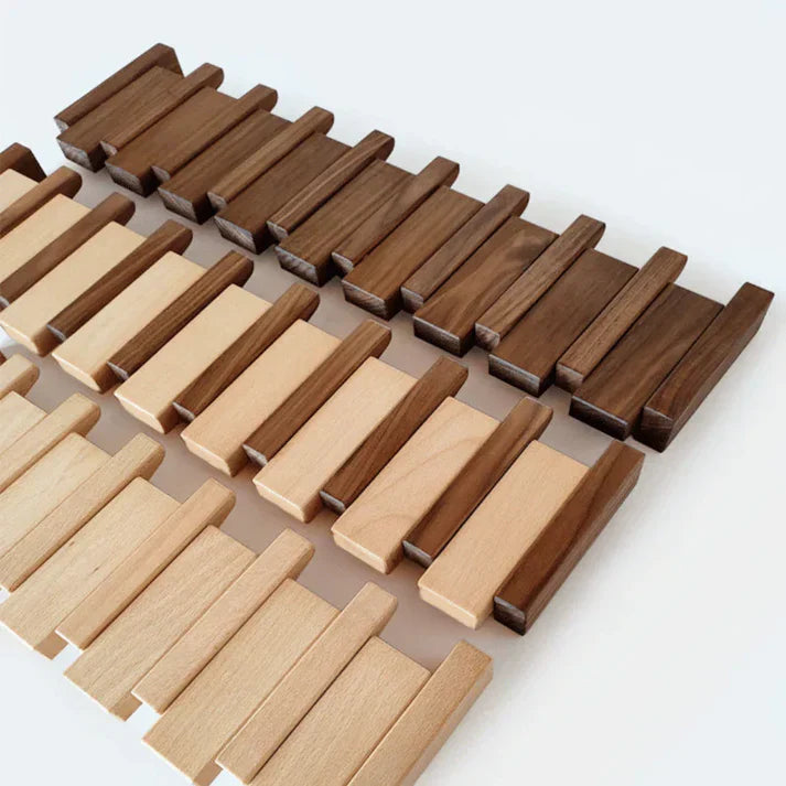 Wooden wall mounted coat rack with flip-down piano key hooks