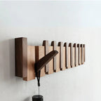 Wooden wall mounted coat rack with flip-down piano key hooks